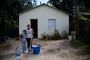 Ana and Mailine outside their new home built for them last July 2011