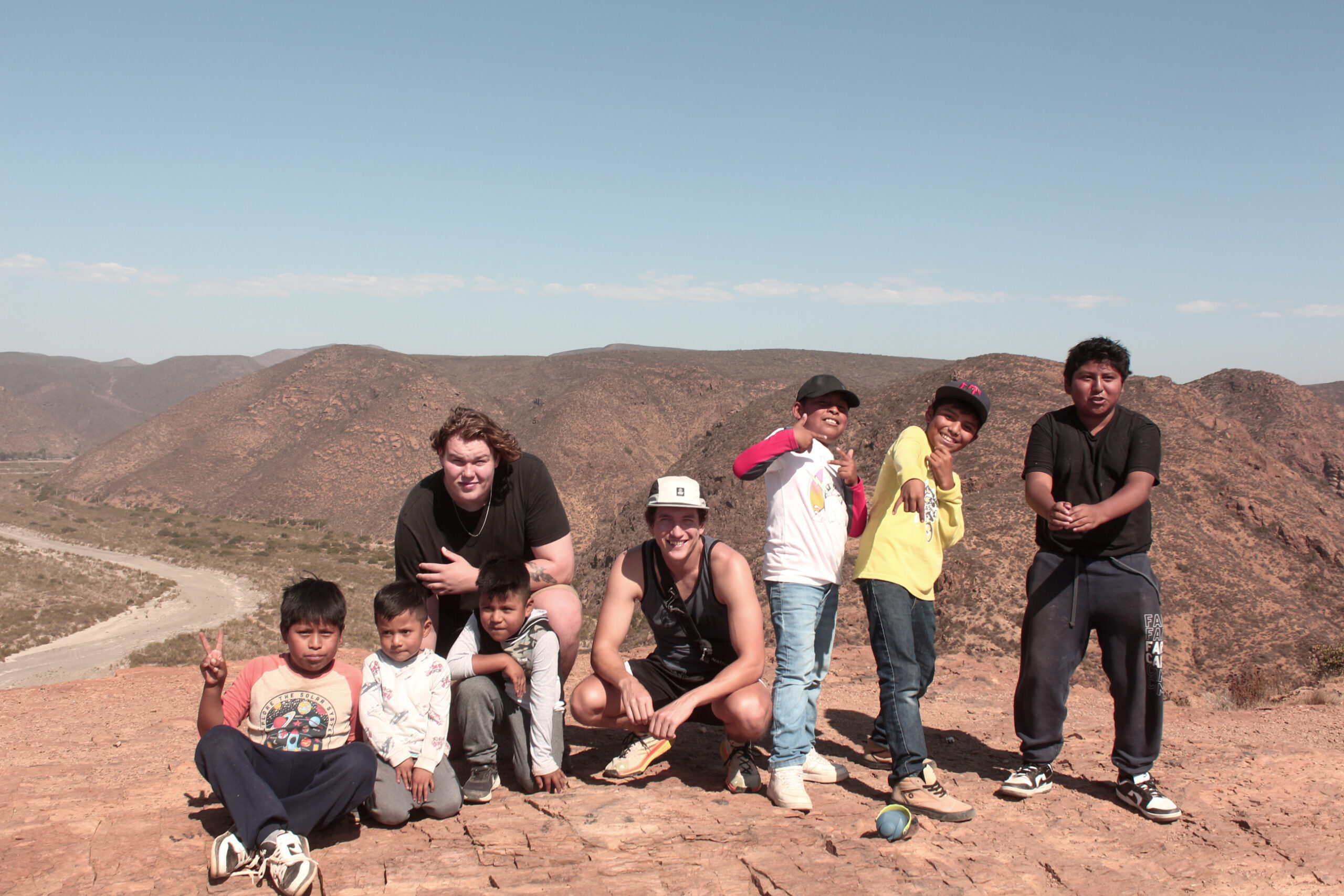 Group posing on mountain landscape