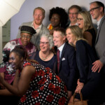 Group of people posing for a photo together.