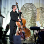 Musicians performing with double bass and keyboard.