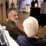 People talking at a social event