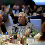 People dining at a formal banquet event.