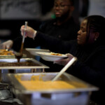 Person serving food at a buffet
