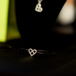 Heart-shaped jewelry on black display stands